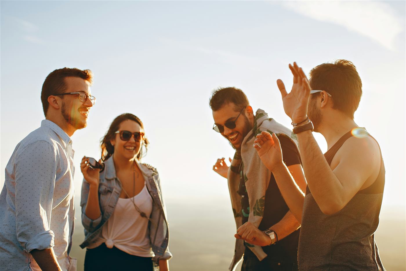 Friends laughing and hanging out together outdoors
